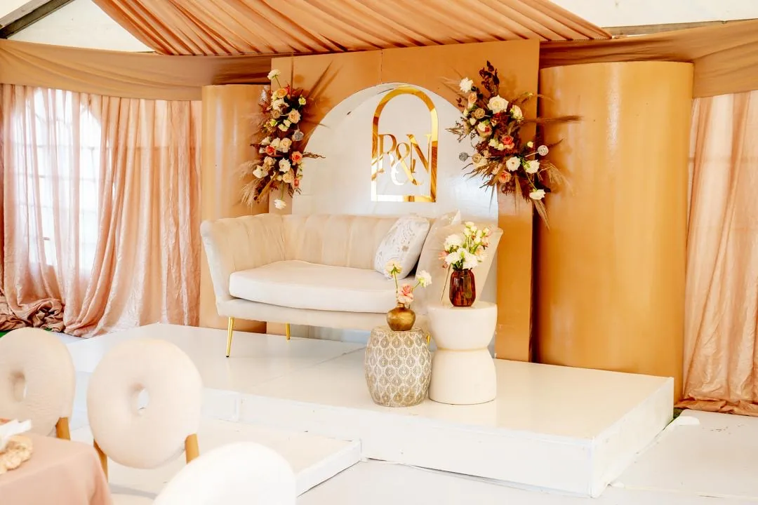 Ivory Sweetheart Stage with Peach Draping and Florals